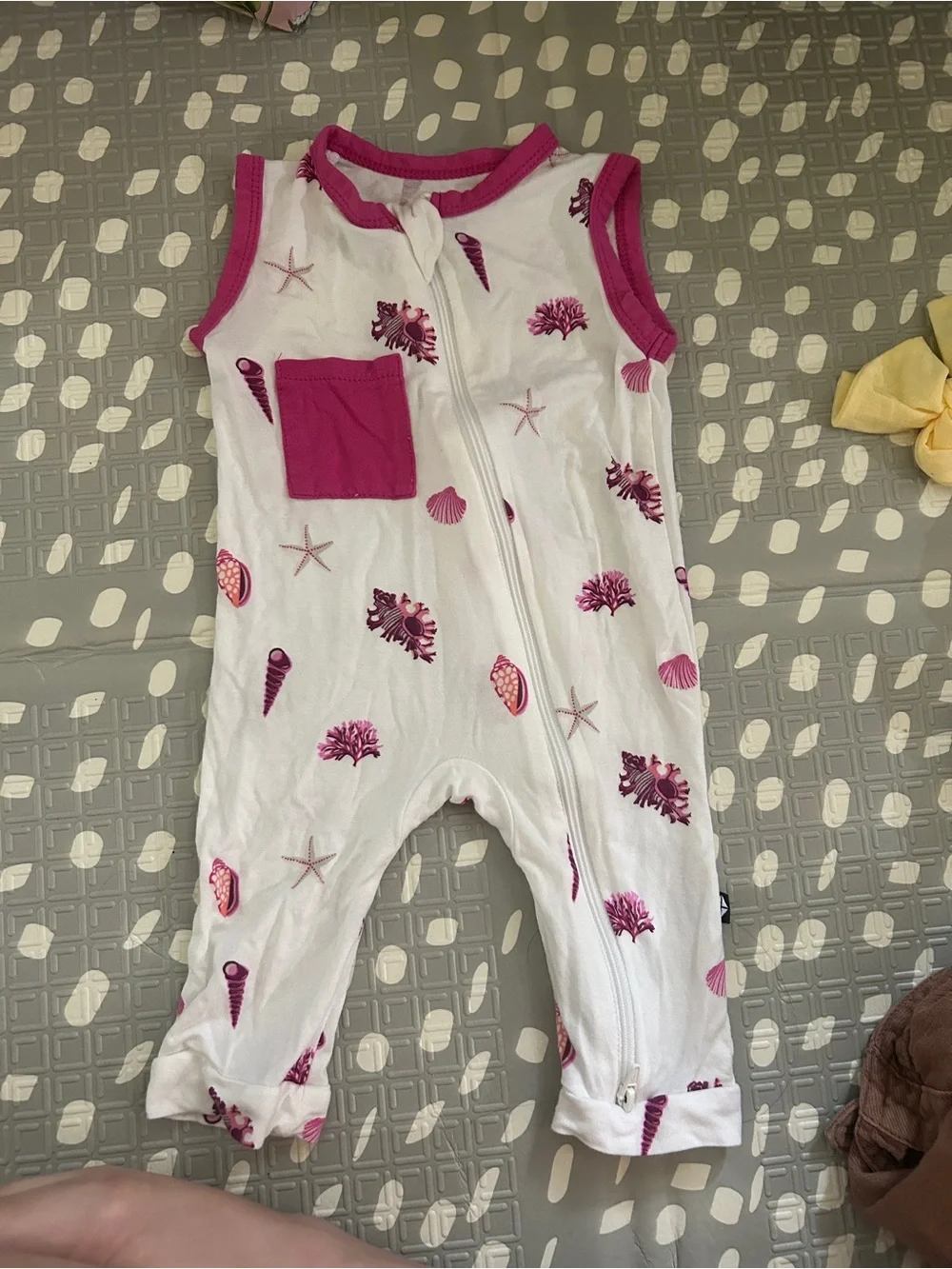 Kyte Baby Sleeveless White Baby Romper with Raspberry Shell Print